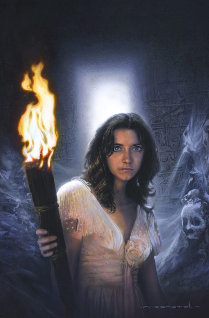 A woman holding a burning torch in front of a wall.